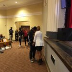 20231011_Student Engagement_Casme_Praying w student at end of assembly